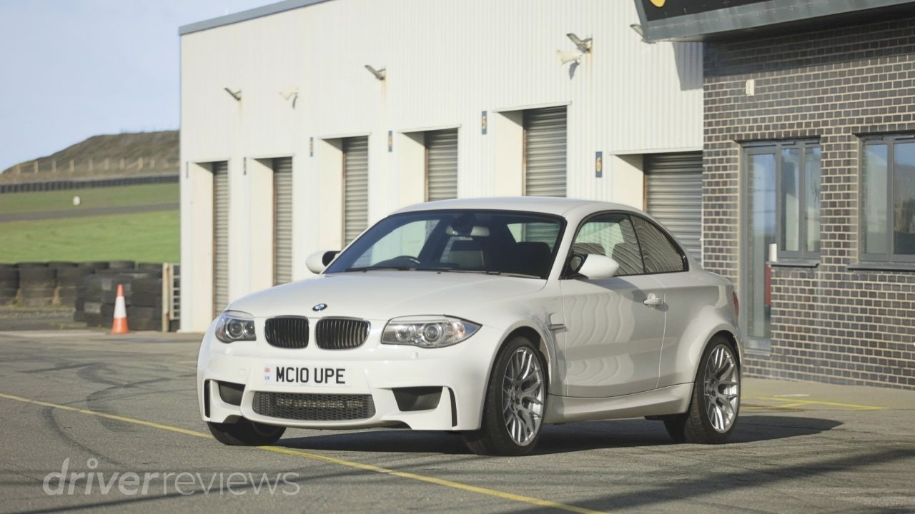 BMW 1M in Alpine White front three-quarter view at Anglesey Circuit