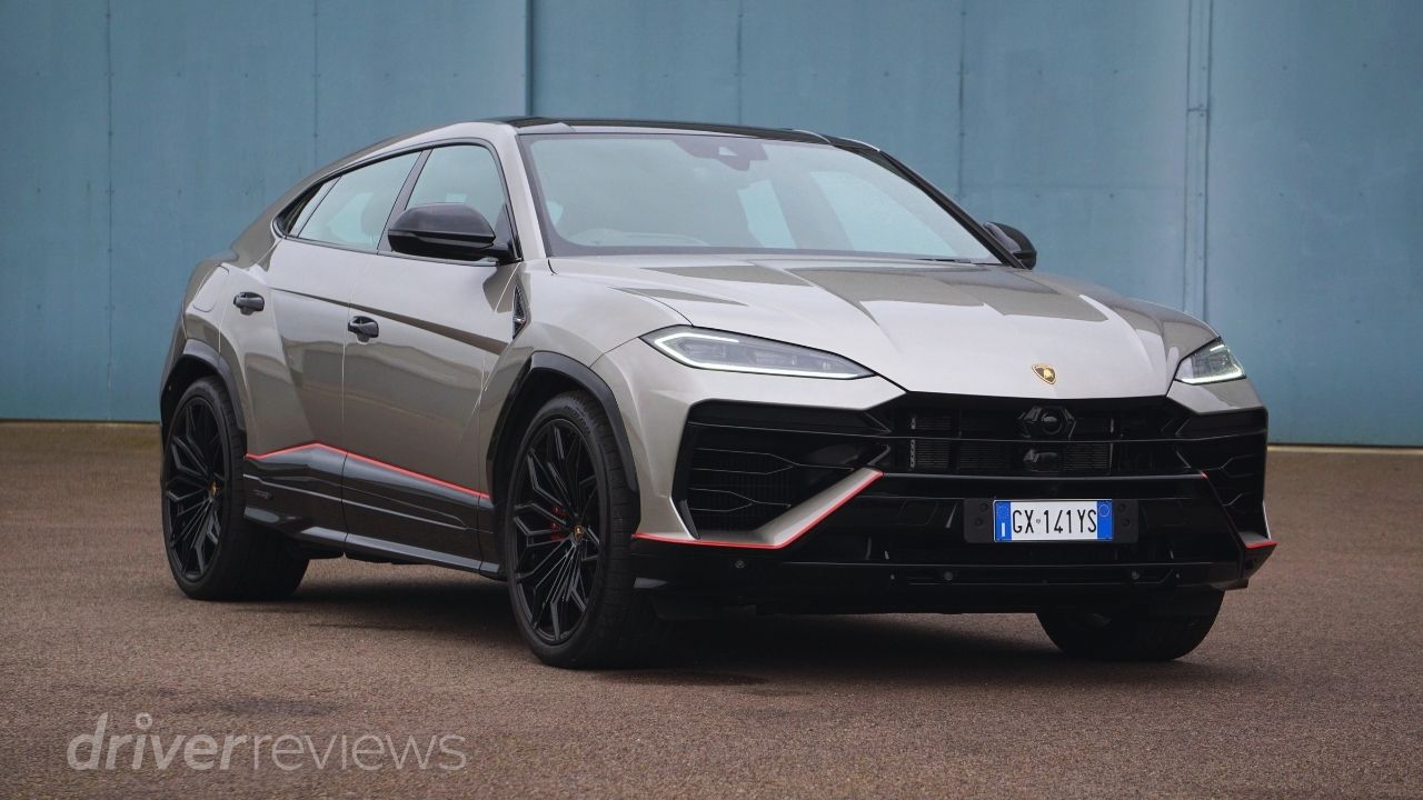 Lamborghini Urus SE front three-quarter view in Grigio Antares with red accent trim during DriverReviews review