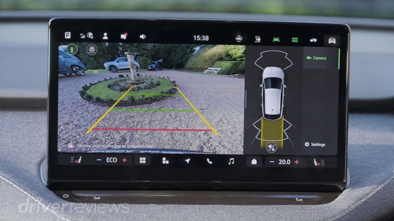 Skoda Elroq 13-inch touchscreen showing reverse camera and area view in DriverReviews test