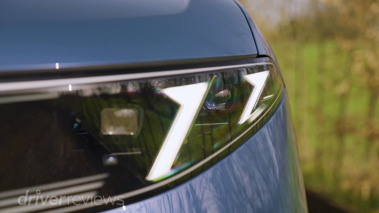 BMW iX3 distinctive Z-shaped LED headlight signature in dark blue metallic