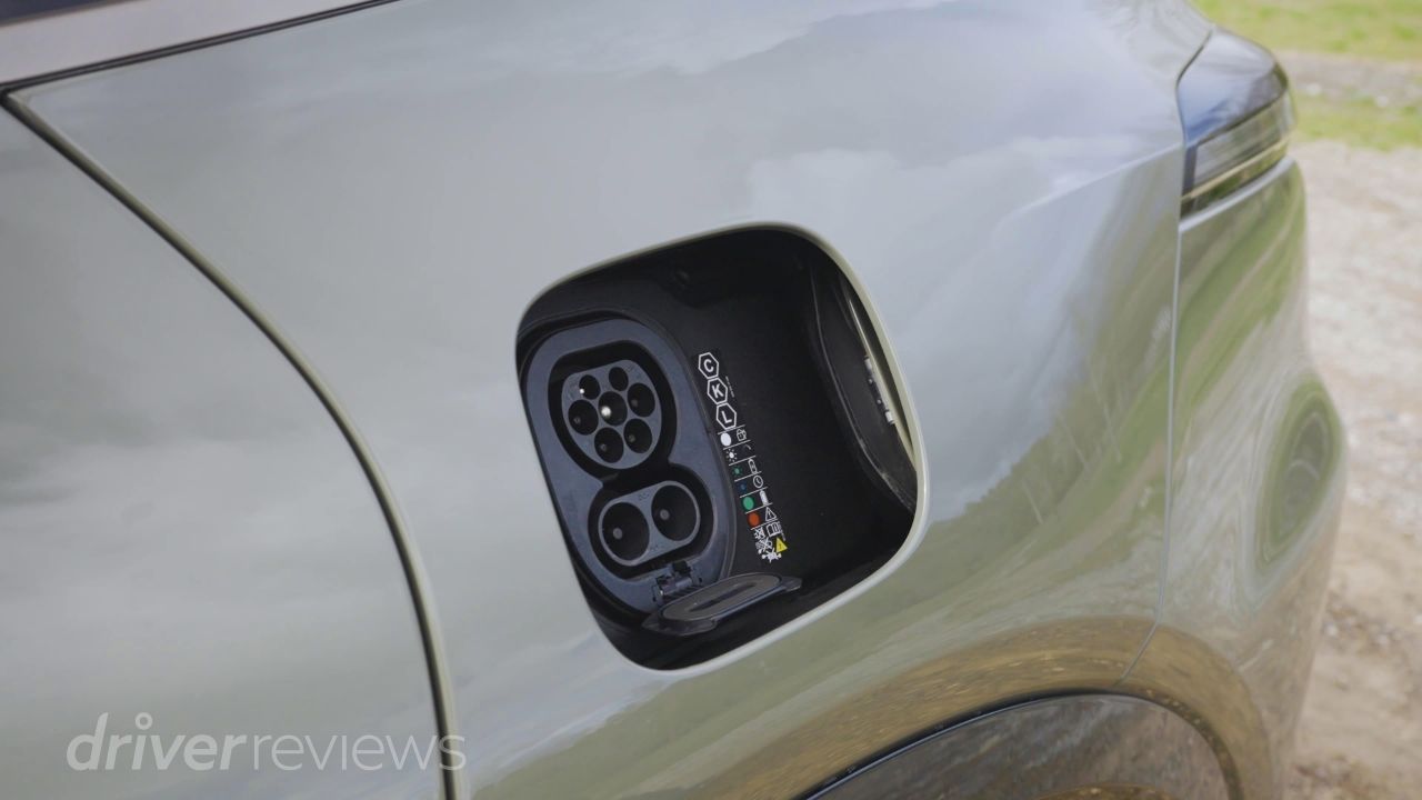 Porsche Cayenne Turbo Electric CCS charging port open showing AC and DC connectors