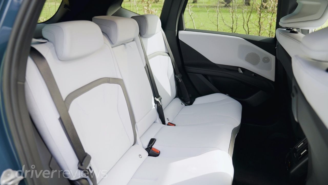 BMW iX3 rear seats in white leather with three-seat bench and generous legroom