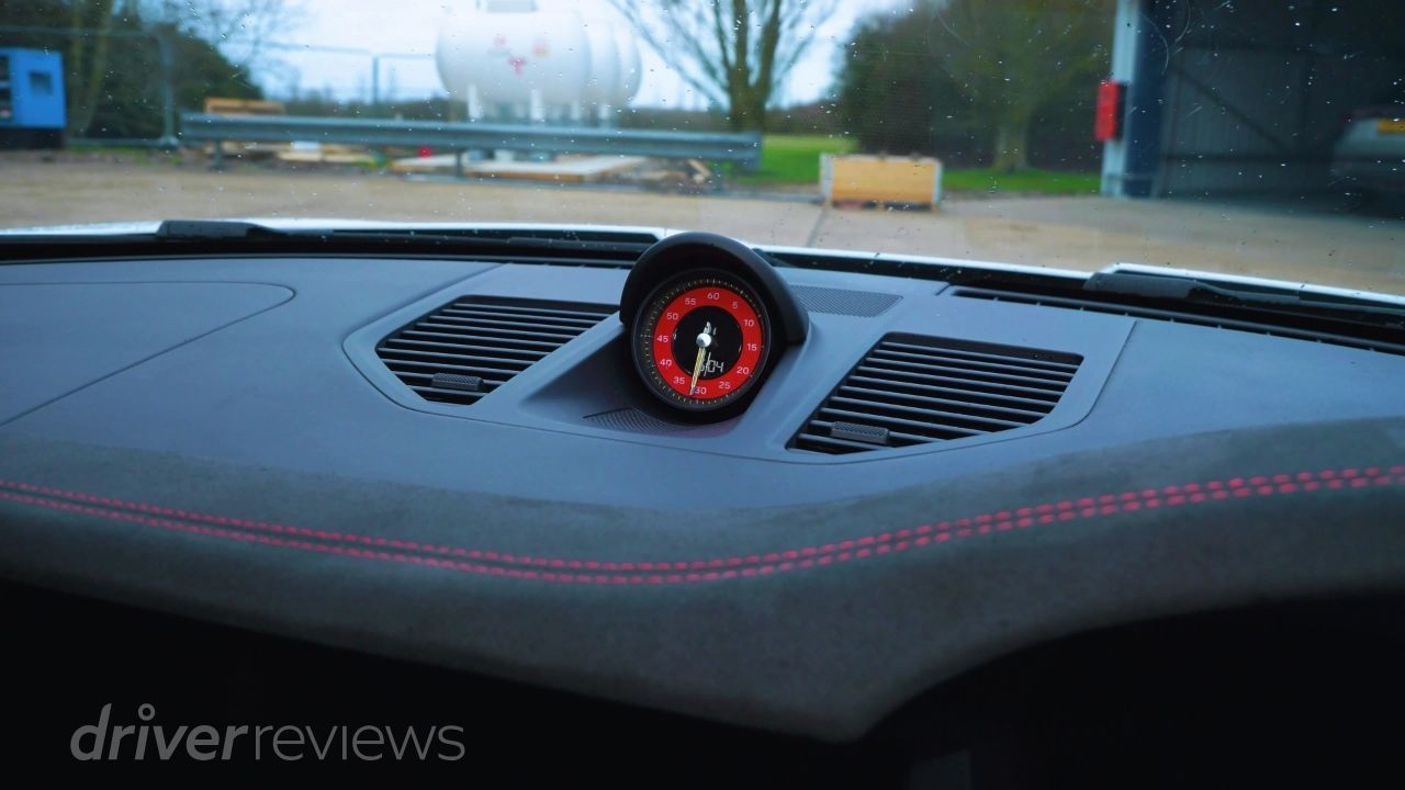 Porsche 911 GT3 Sport Chrono stopwatch on suede dashboard during DriverReviews test