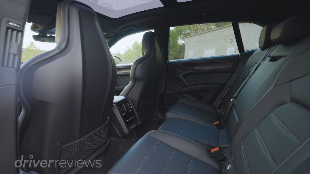 Porsche Cayenne Turbo Electric rear seats showing legroom and individual climate controls in DriverReviews test