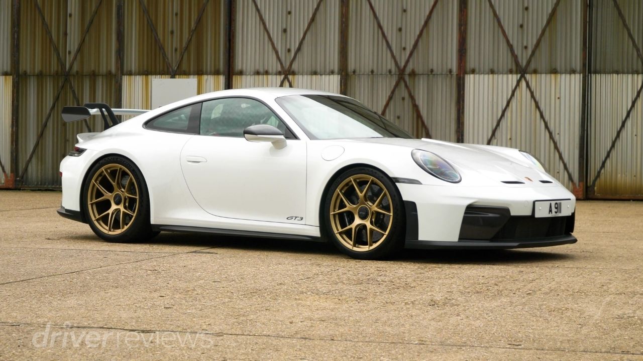 Porsche 911 GT3 992.2 full side profile in white with California Gold Weissach Package magnesium wheels at DriverReviews test