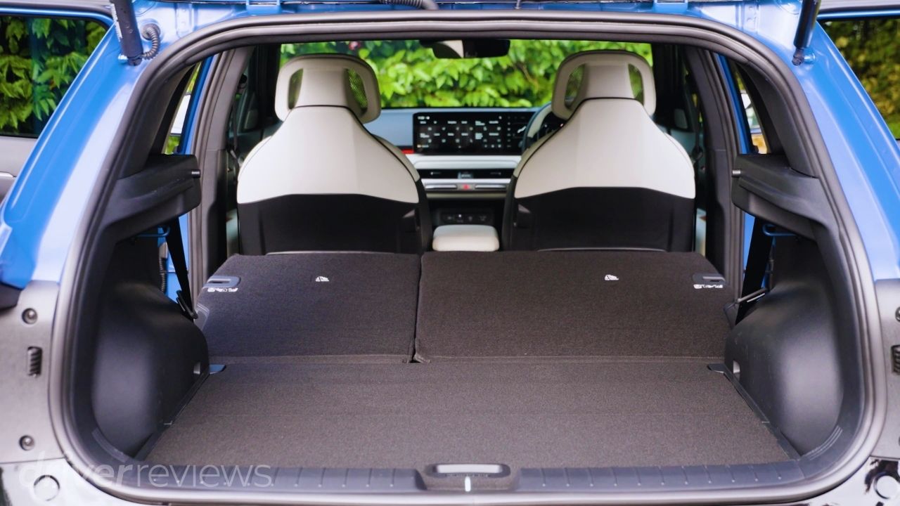 Kia EV4 GT-Line S boot with rear seats folded showing the flat load floor and expanded cargo space