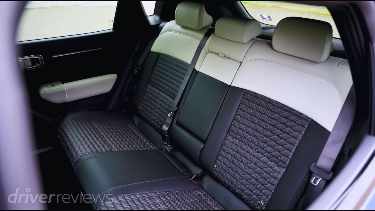 Rear seats of the Kia EV4 GT-Line S showing the three-seat rear bench and flat passenger floor