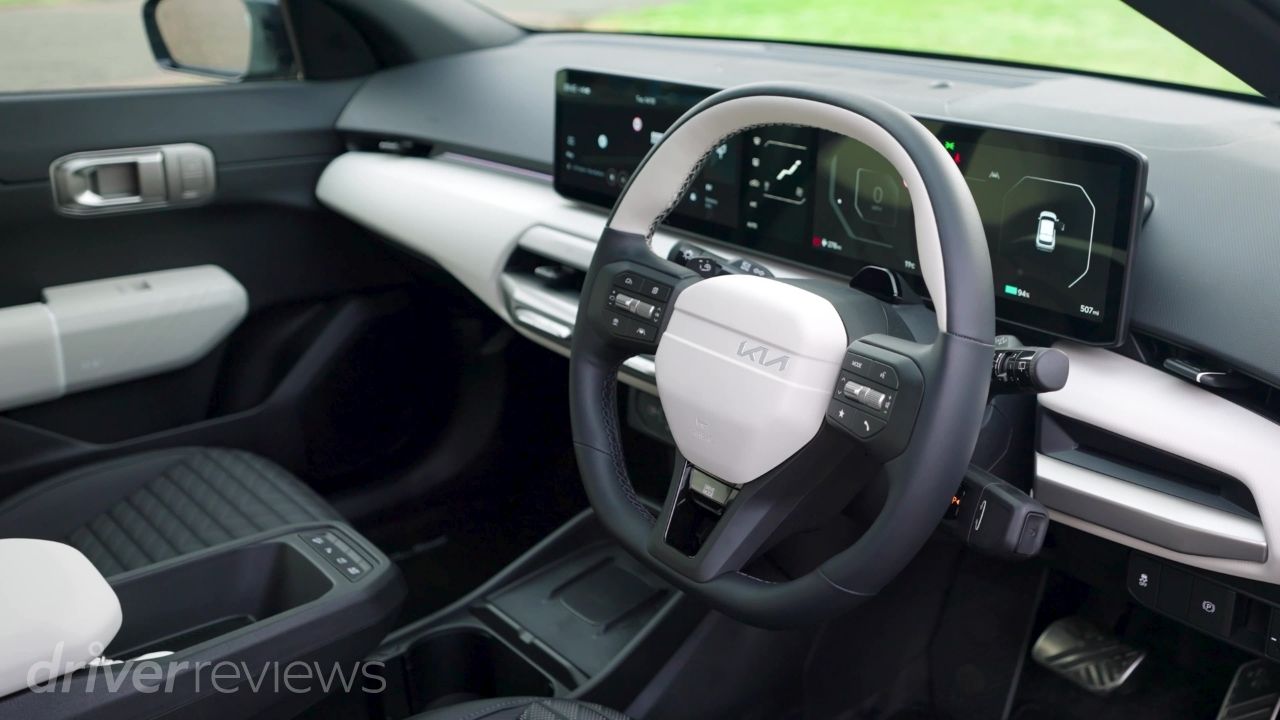 Kia EV4 GT-Line S dashboard with panoramic digital display, central touchscreen and three-spoke steering wheel