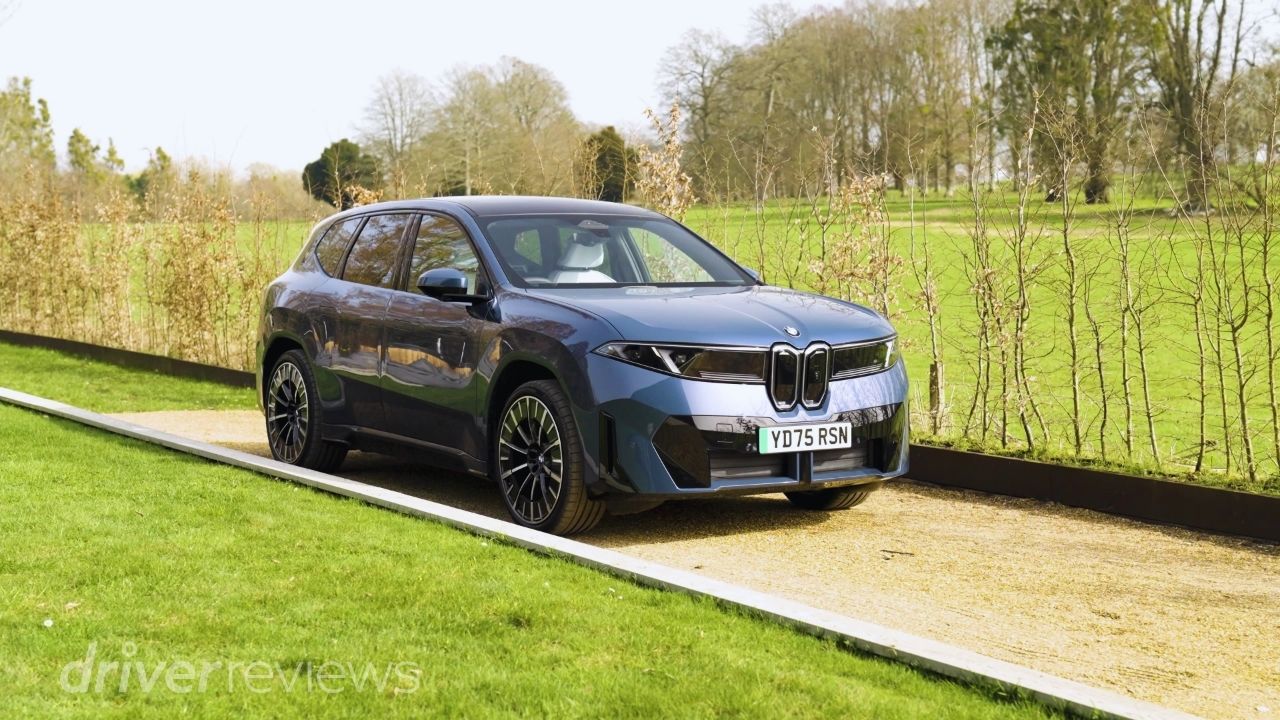 BMW iX3 50 xDrive front three-quarter view in dark blue metallic at DriverReviews test location