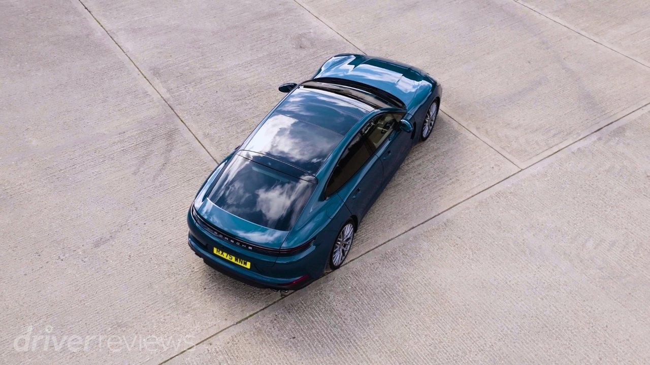 Montego Blue Metallic Porsche Panamera 4 E-Hybrid viewed from above showing its saloon profile and panoramic roof