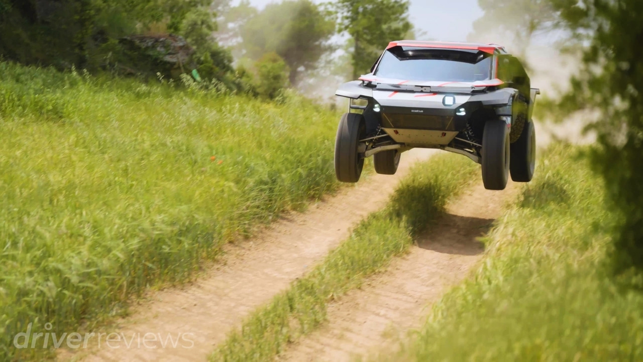 Dacia Sandrider airborne over an off-road rally raid course during testing in Spain