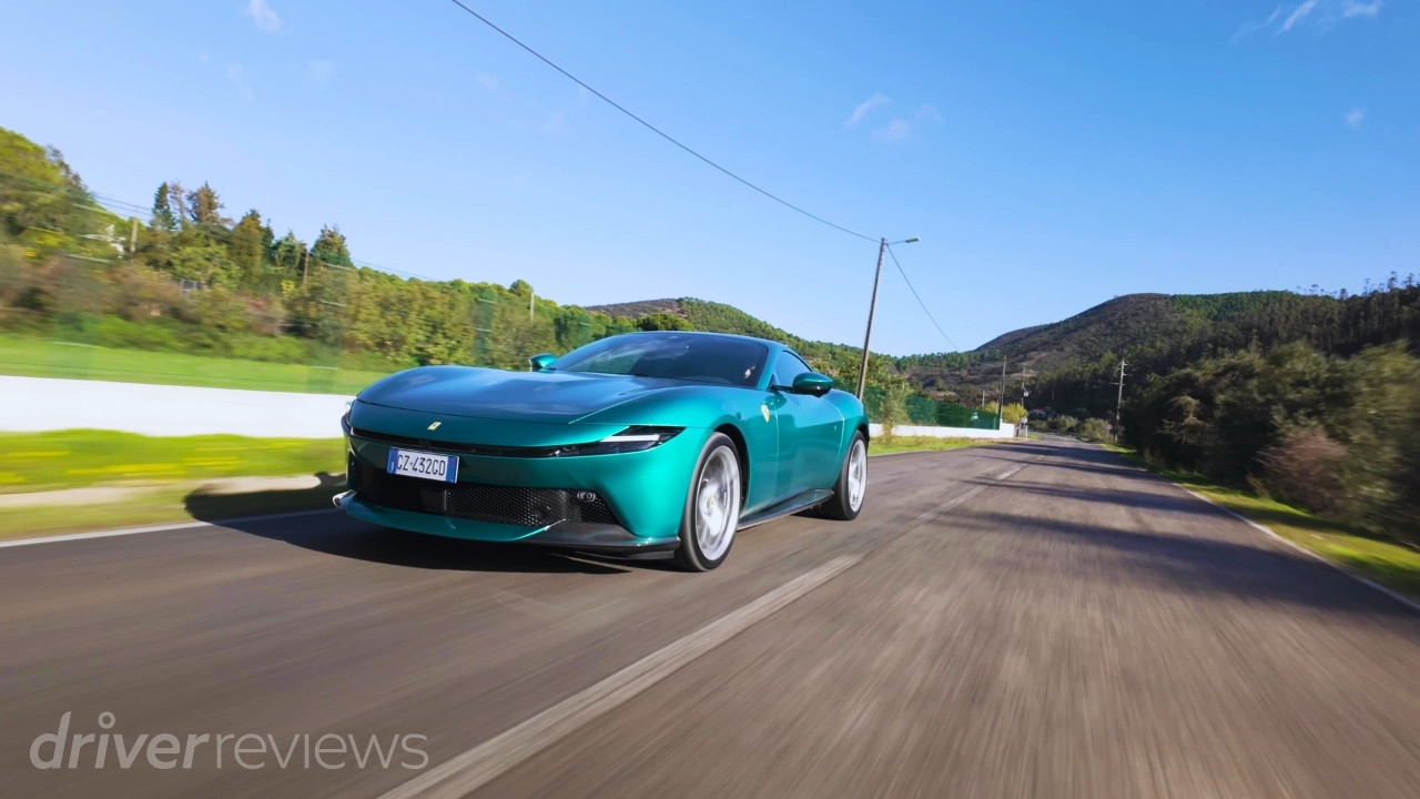 Green Ferrari Amalfi driving on a road in Portugal