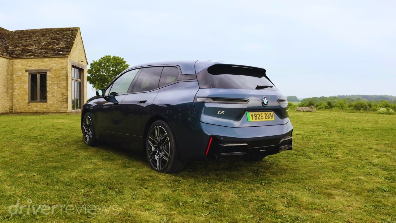 2025 BMW iX xDrive60 M Sport in Arctic Race Blue, rear three-quarter exterior view
