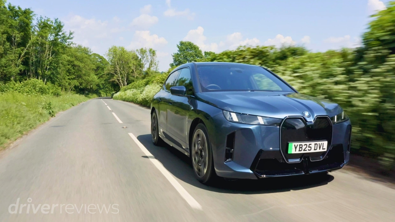 BMW iX xDrive60 M Sport driving on a country road