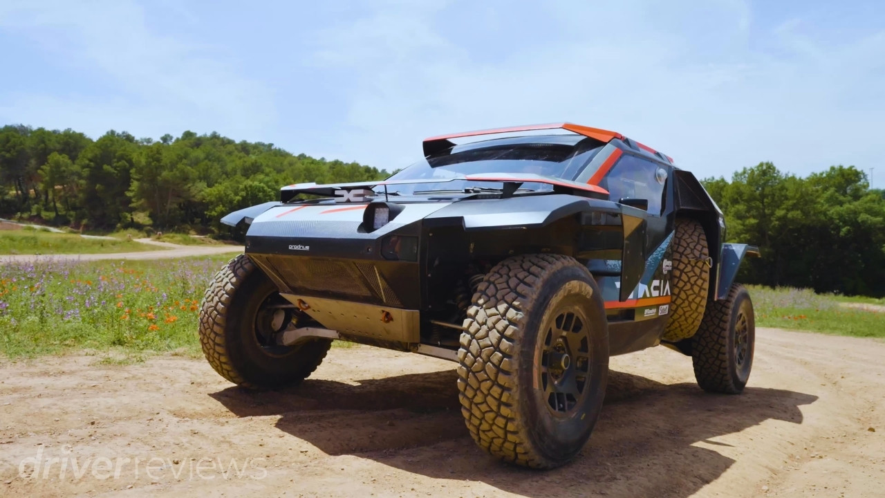 Dacia Sandrider rally raid car in front three-quarter view on an off-road course in Spain