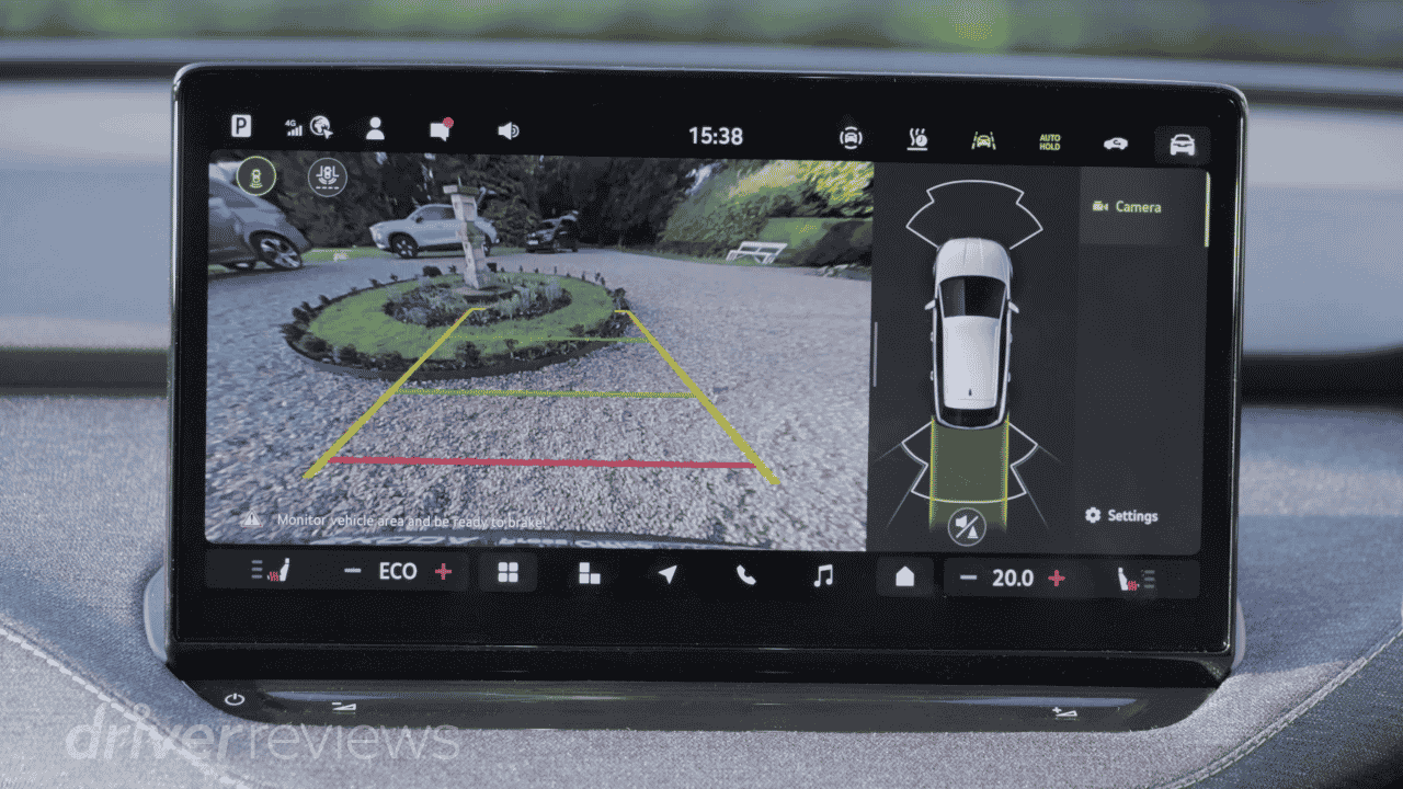 Skoda Elroq 13-inch touchscreen showing reverse camera and area view in DriverReviews test