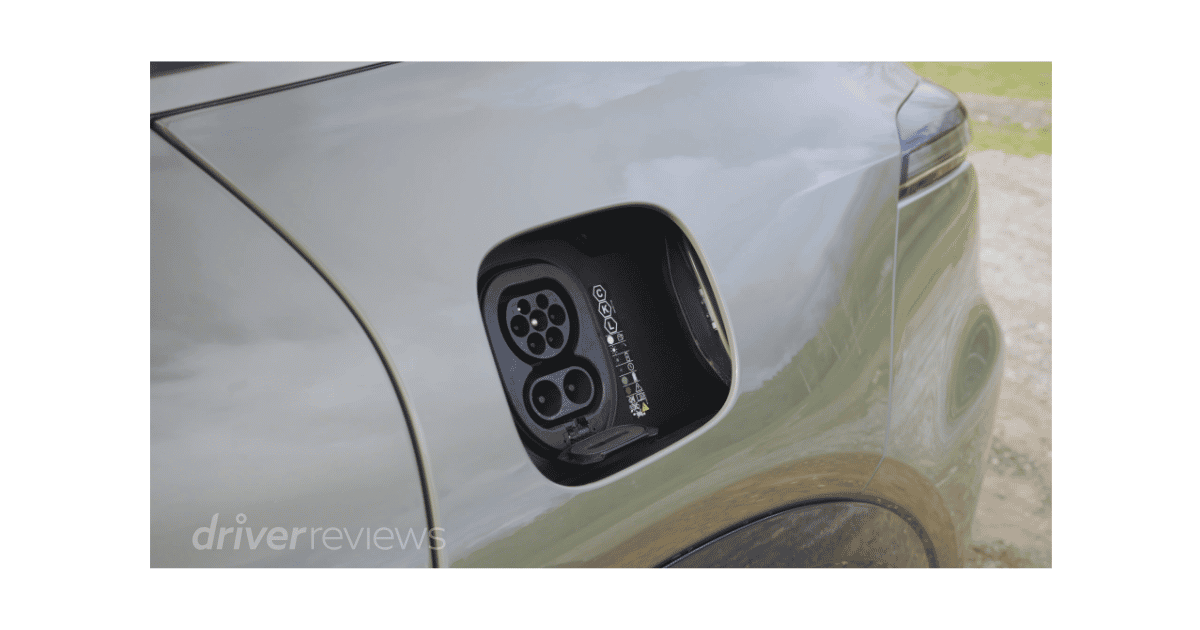 Porsche Cayenne Turbo Electric CCS charging port open showing AC and DC connectors