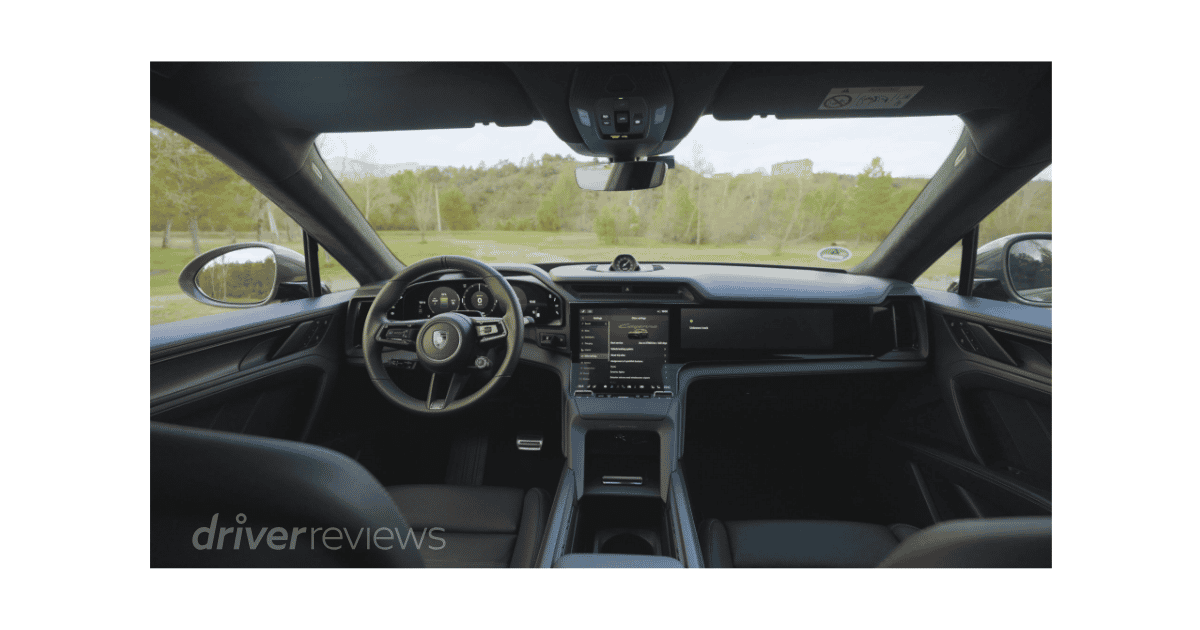 Porsche Cayenne Turbo Electric interior with Flow Display curved OLED screen and Porsche steering wheel in DriverReviews test